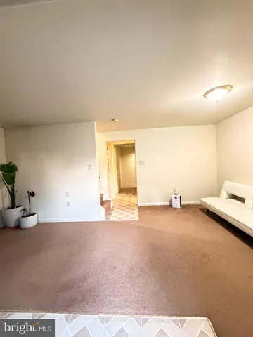 a view of a livingroom with furniture and a couch