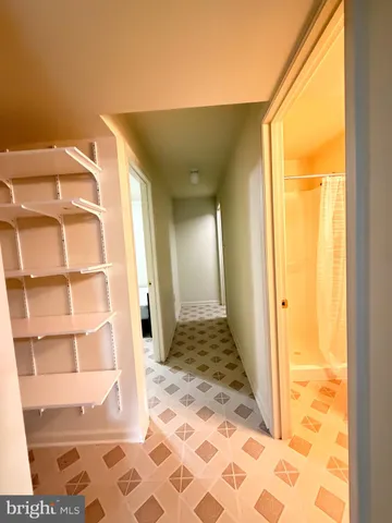 a bedroom with a bed and a rug