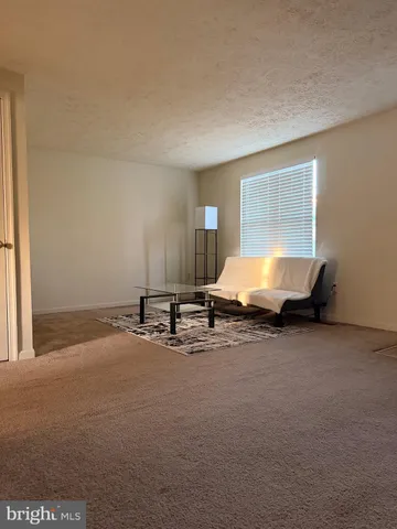 a room with furniture and window