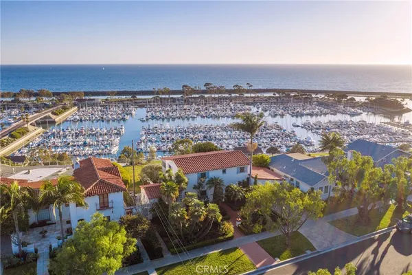 an aerial view of residential building and lake