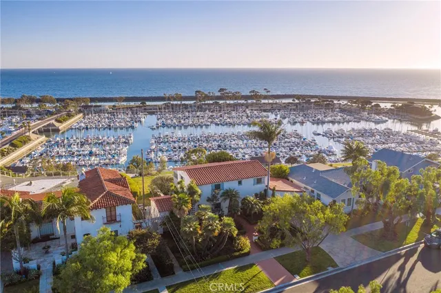 an aerial view of residential building and lake