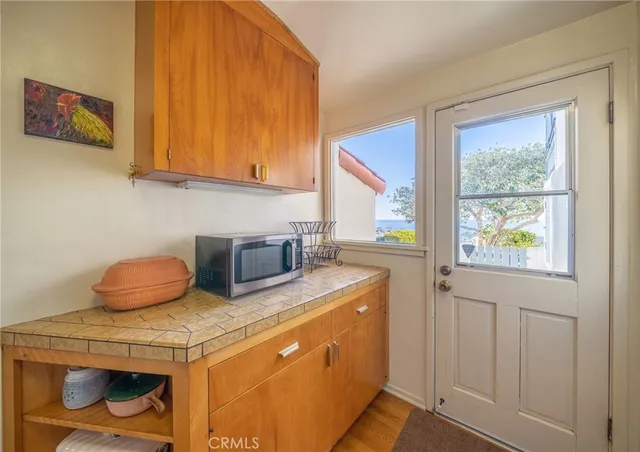 a kitchen with sink and cabinets