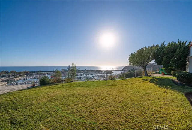 a view of a swimming pool with an outdoor seating