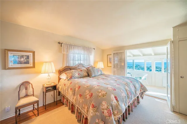 a bedroom with two beds and a couch