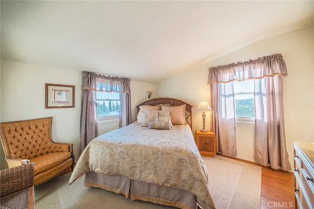 a bedroom with a bed and a couch