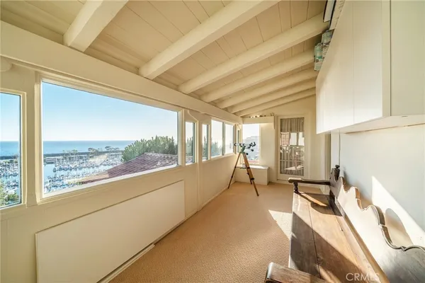 an aerial view of residential building and ocean