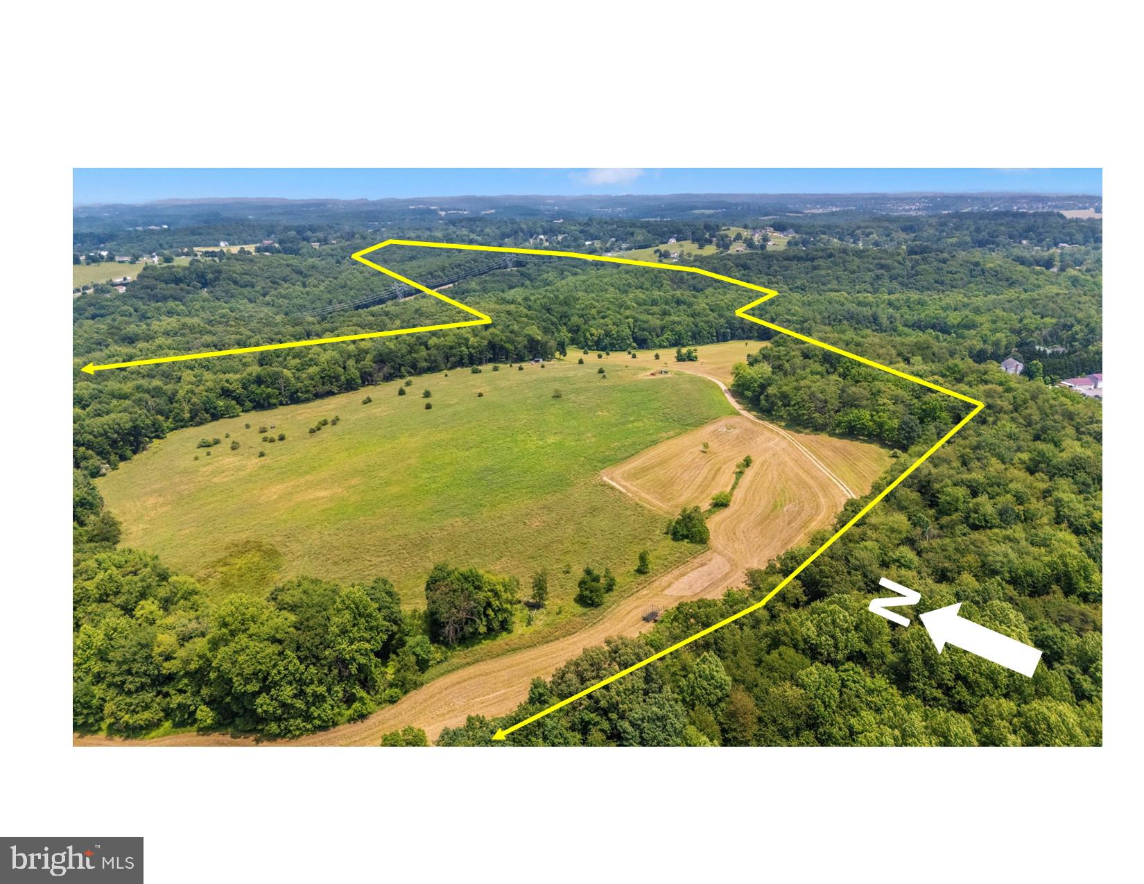 5311 Woodville Road Mount Airy, MD 21771 - Photo 3 of 27 a view of a field with an ocean view