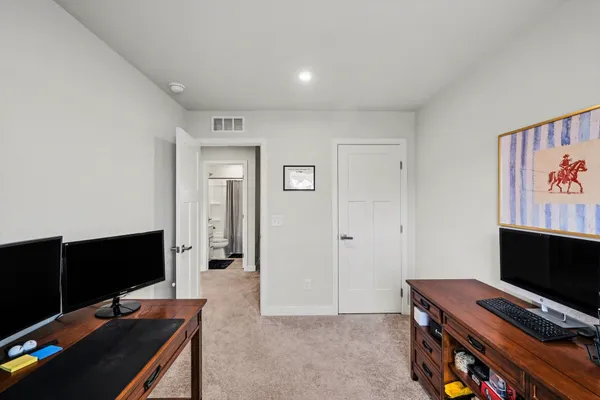 a view of a workspace with furniture