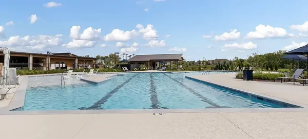 a view of a swimming pool with an outdoor seating