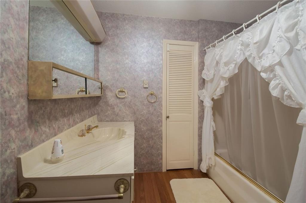 288 Rockledge Road Spruce Pine, NC 28777 - Photo 11 of 27 a bathroom with a sink and shower