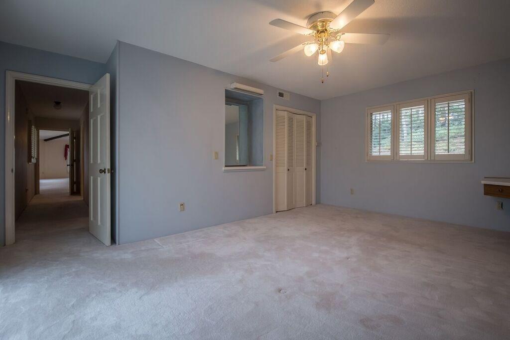288 Rockledge Road Spruce Pine, NC 28777 - Photo 15 of 27 a view of a livingroom with a ceiling fan and window