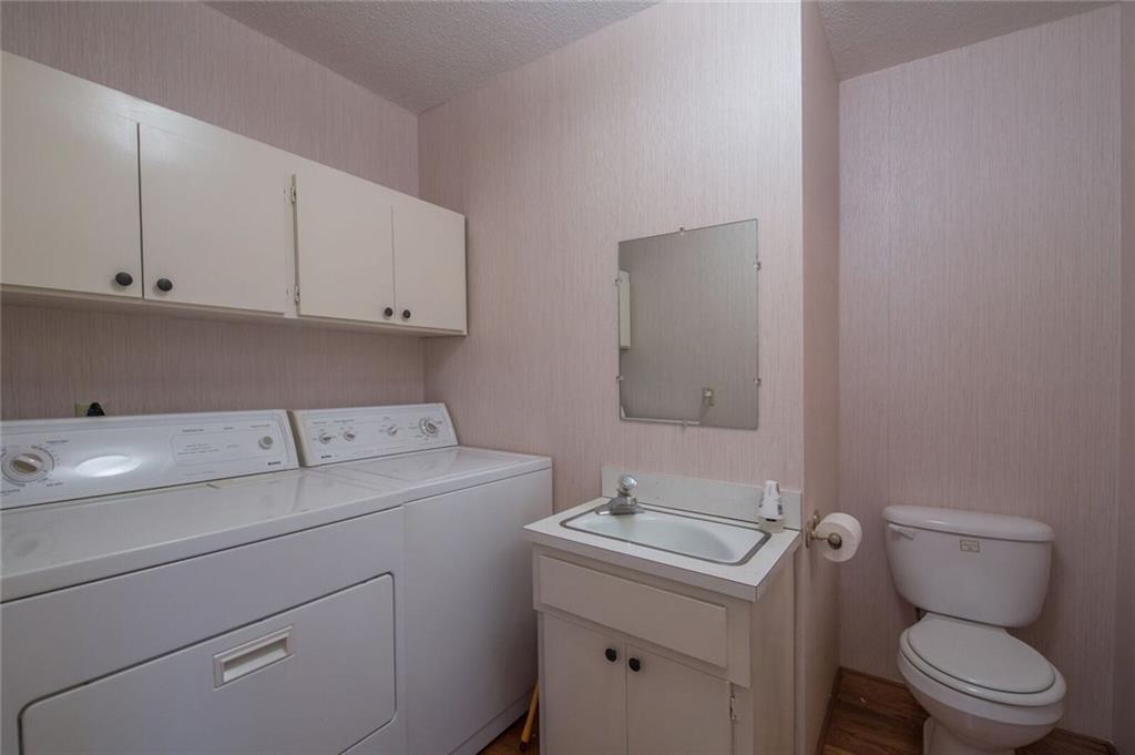 288 Rockledge Road Spruce Pine, NC 28777 - Photo 19 of 27 a utility room with dryer and washer