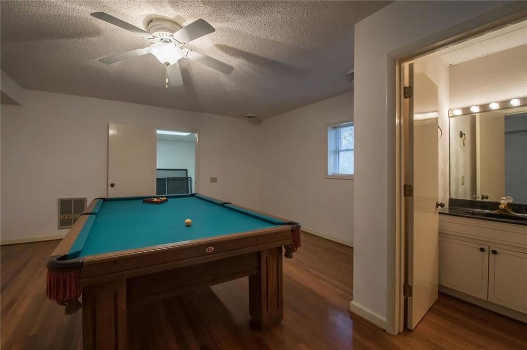 288 Rockledge Road Spruce Pine, NC 28777 - Photo 22 of 27 a room with furniture and a flat screen tv