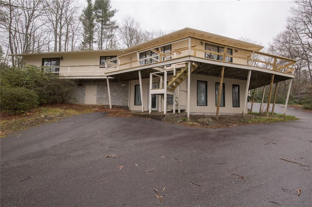 288 Rockledge Road Spruce Pine, NC 28777 - Photo 23 of 27 a front view of a house with a garden