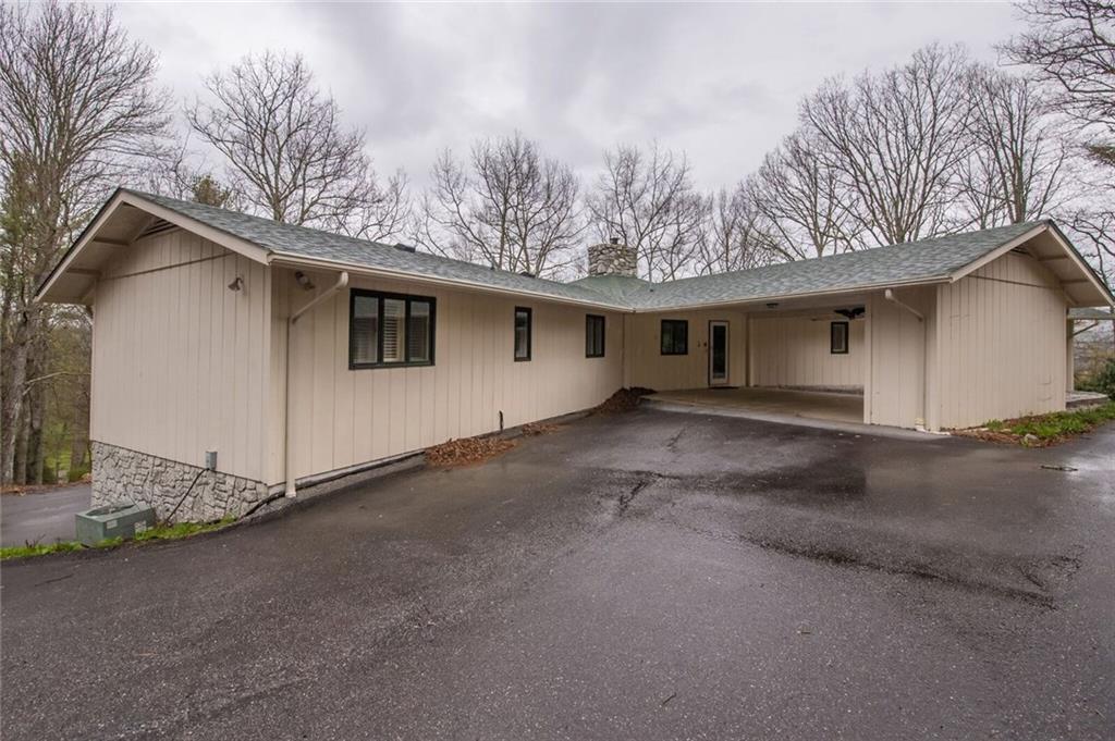 288 Rockledge Road Spruce Pine, NC 28777 - Photo 27 of 27 a view of a house with a yard and garage