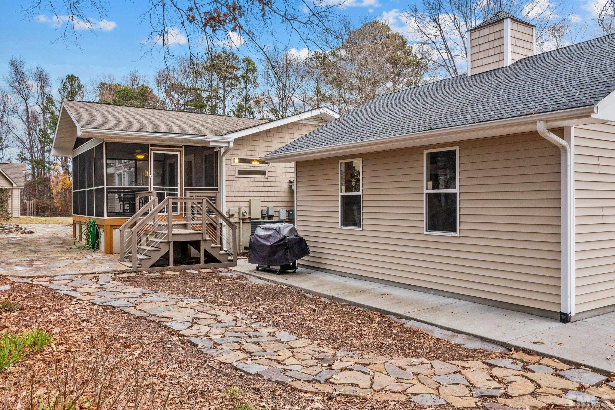 1613 Jenks Carpenter Road Cary, NC 27519 - Photo 12 of 60 a view of a house with a patio
