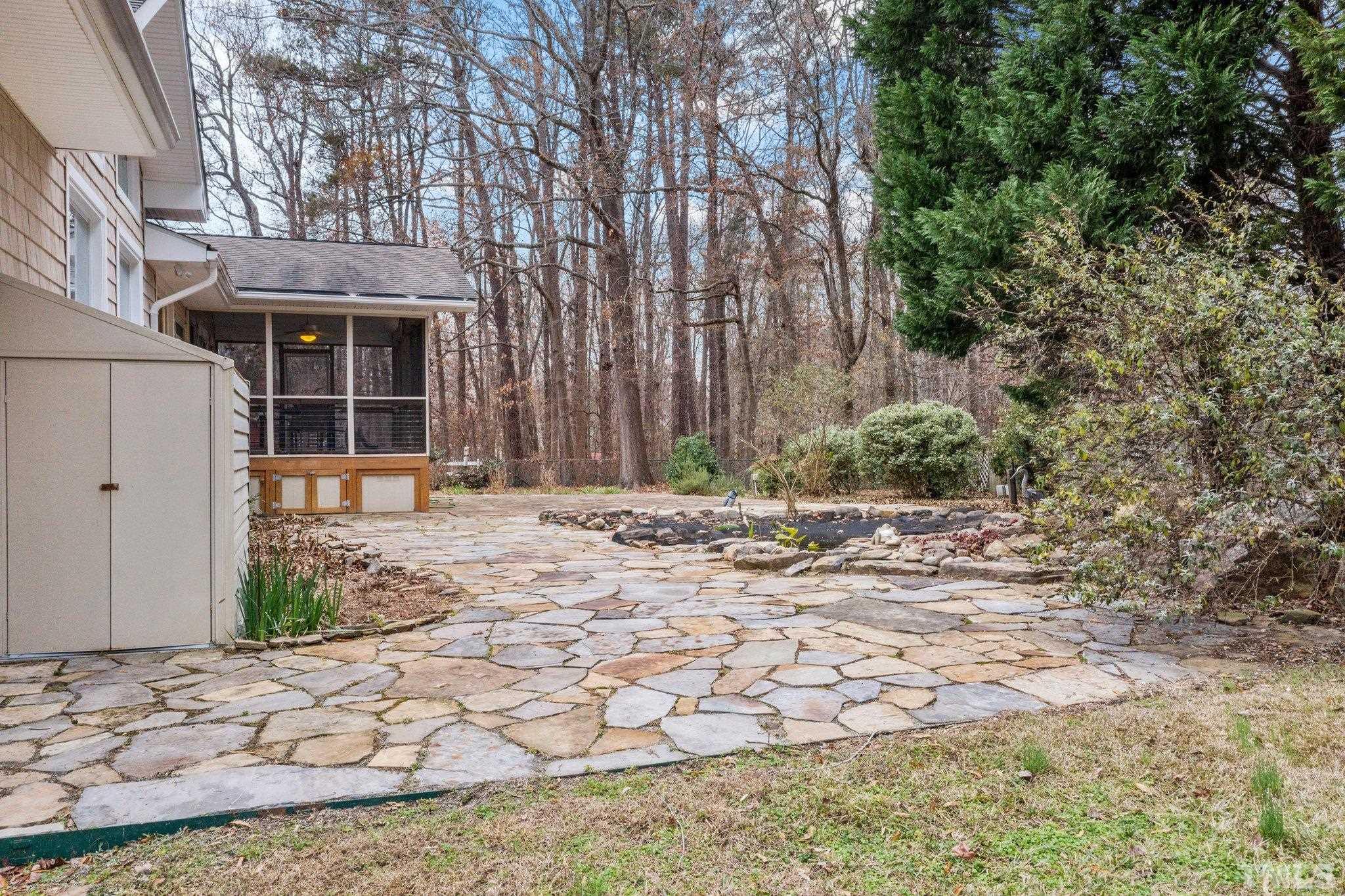1613 Jenks Carpenter Road Cary, NC 27519 - Photo 13 of 60 a front view of a house with a yard