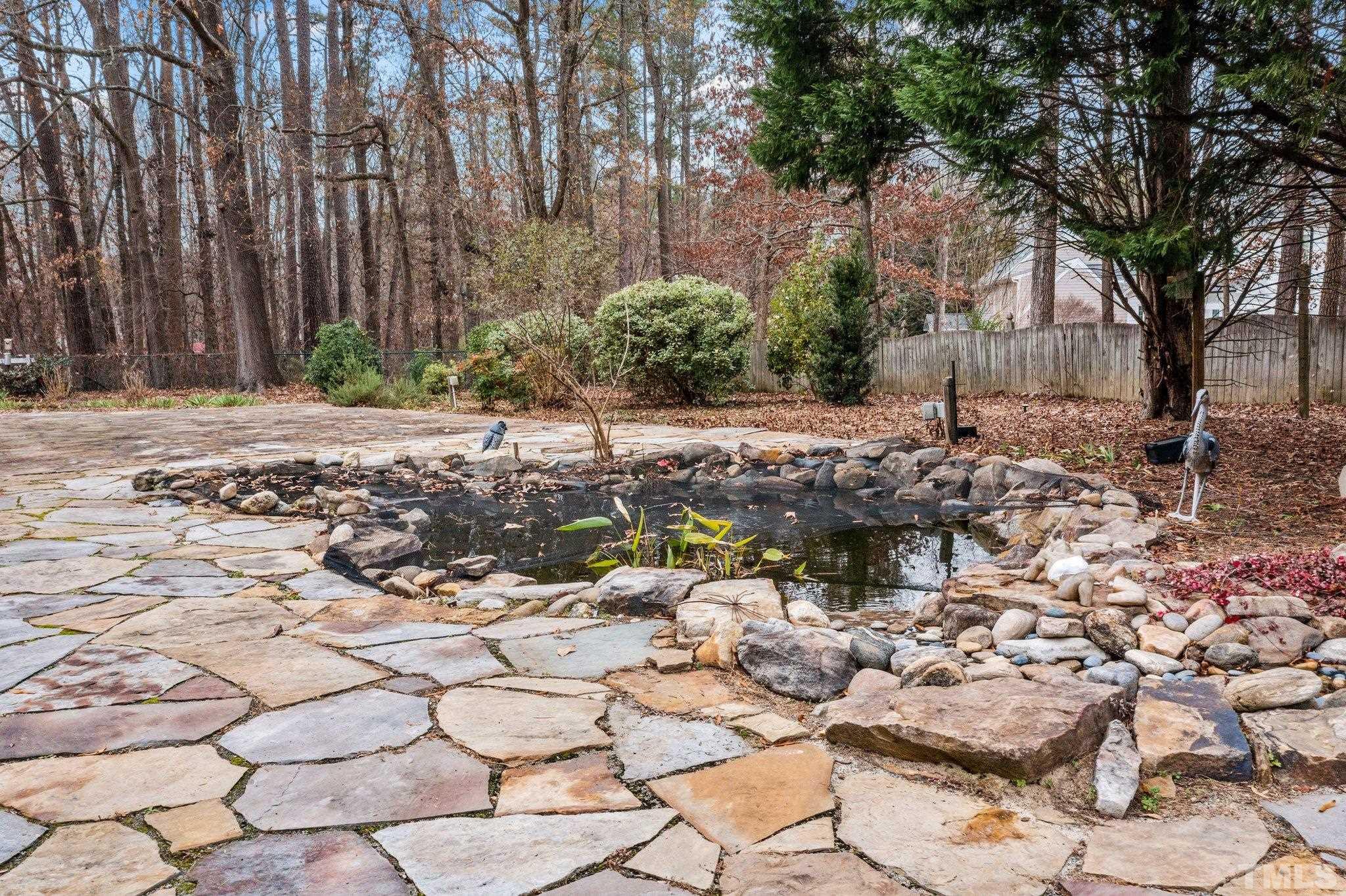 1613 Jenks Carpenter Road Cary, NC 27519 - Photo 14 of 60 a view of a pathway with a yard