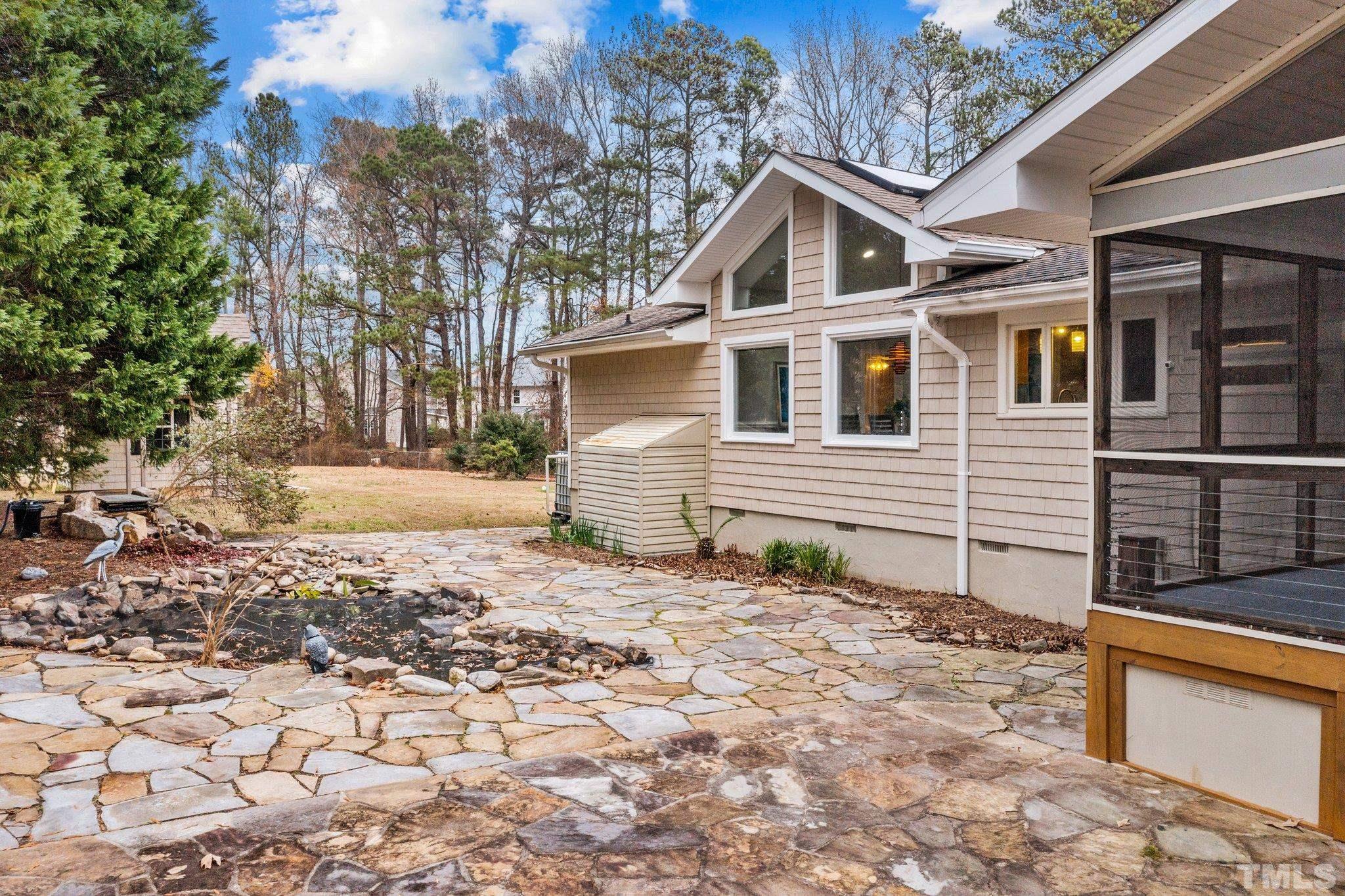 1613 Jenks Carpenter Road Cary, NC 27519 - Photo 15 of 60 a front view of a house with a yard