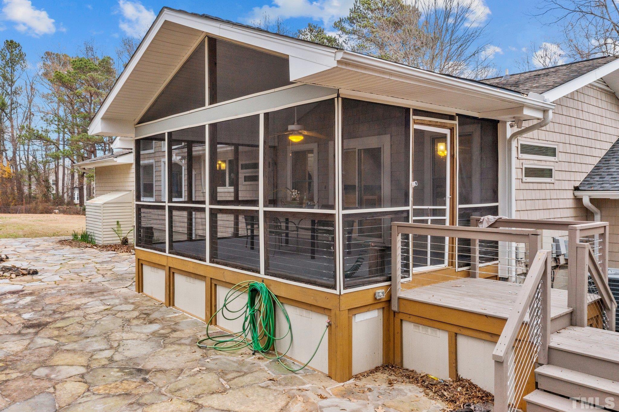 1613 Jenks Carpenter Road Cary, NC 27519 - Photo 16 of 60 a view of a house with a wooden fence