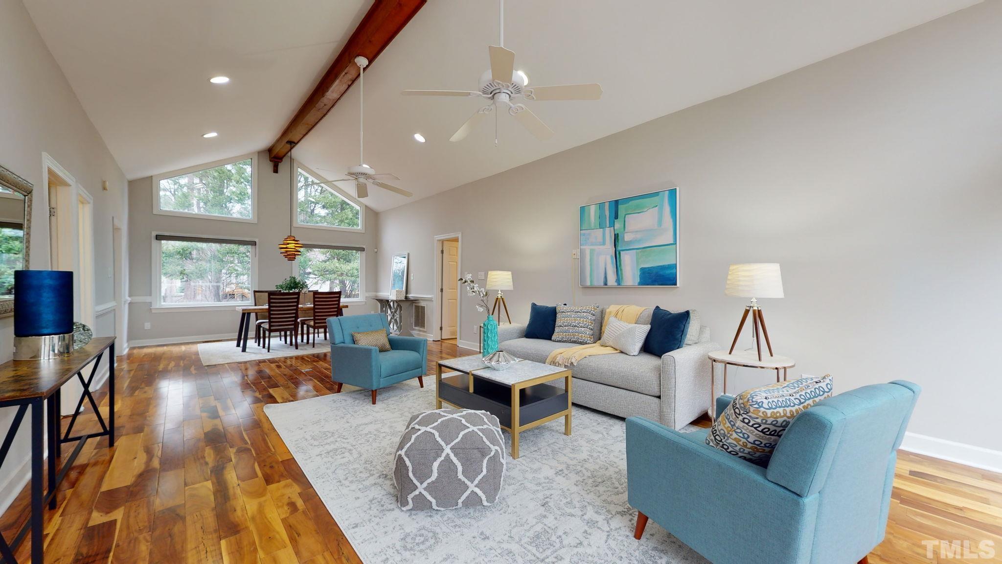 1613 Jenks Carpenter Road Cary, NC 27519 - Photo 22 of 60 a living room with furniture and a large window