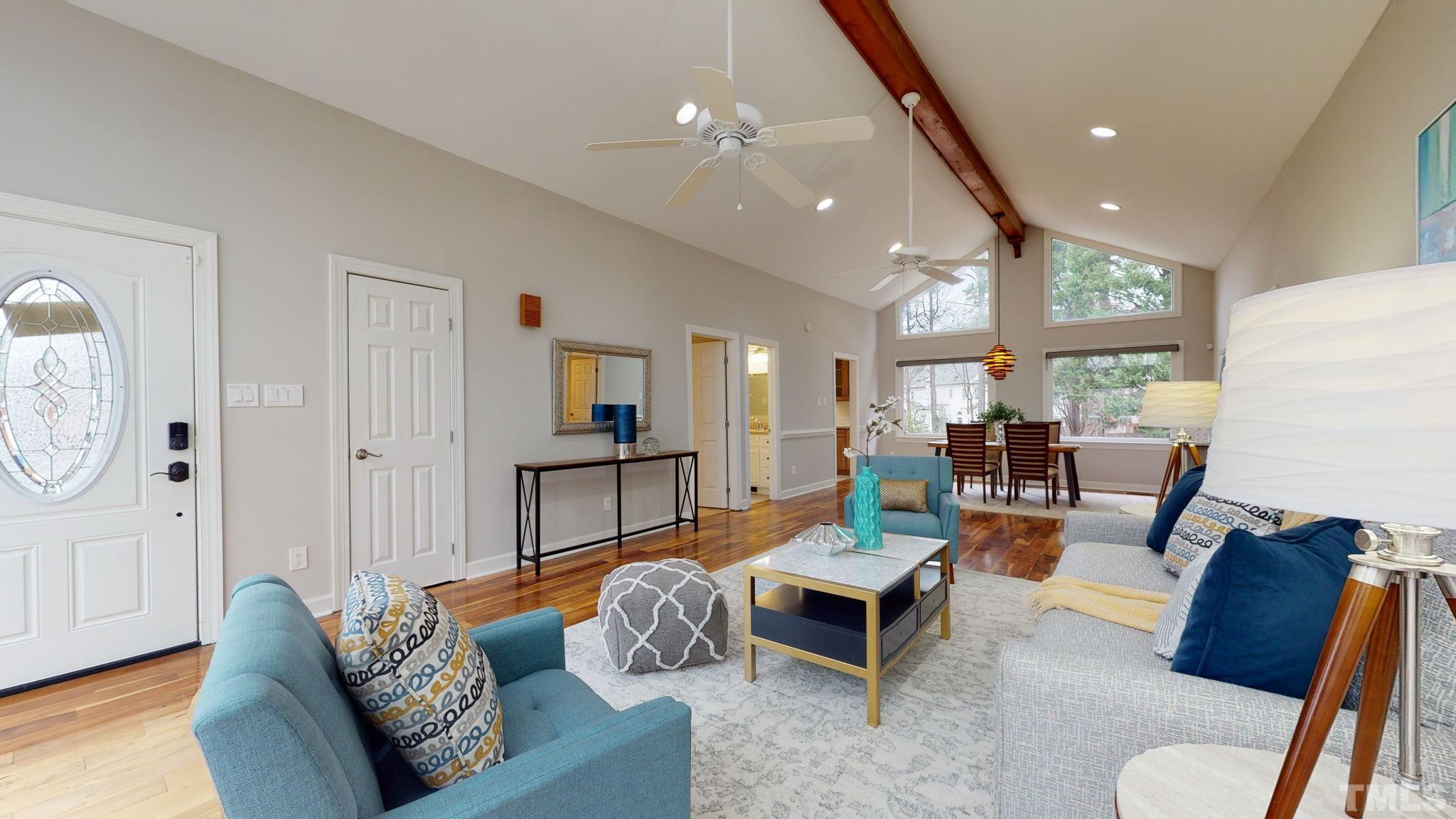 1613 Jenks Carpenter Road Cary, NC 27519 - Photo 23 of 60 a living room with furniture and a wooden floor