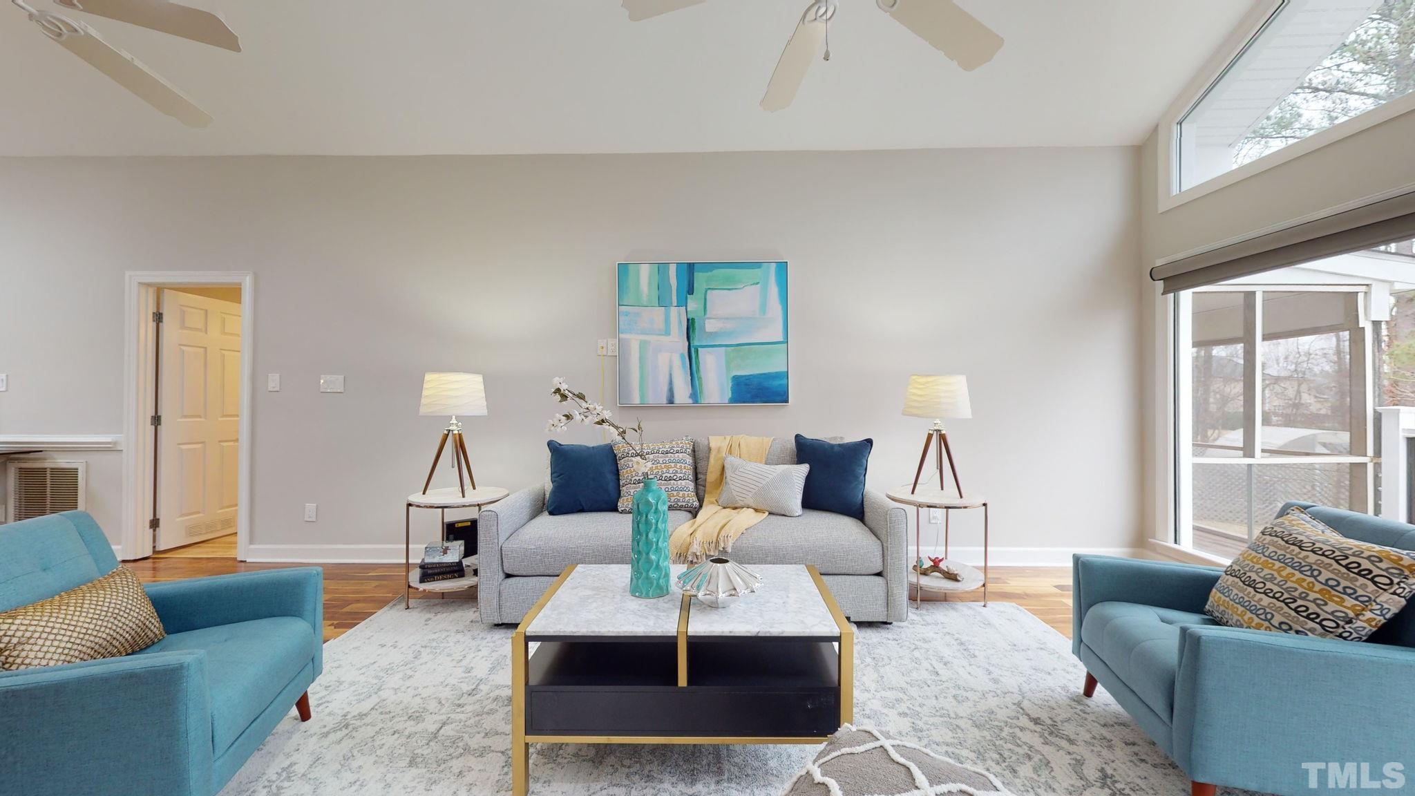 1613 Jenks Carpenter Road Cary, NC 27519 - Photo 24 of 60 a living room with furniture a rug and a large window