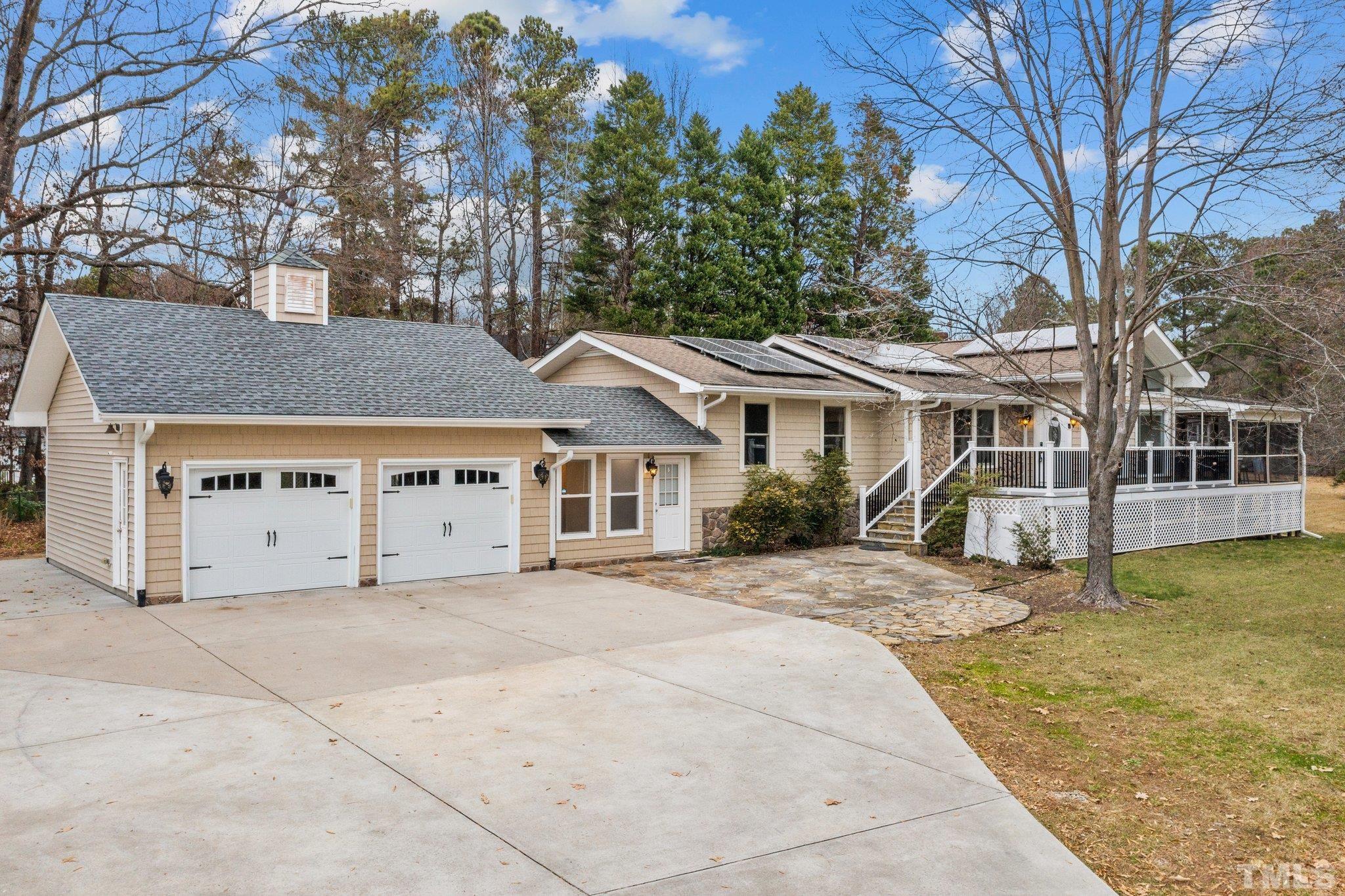 1613 Jenks Carpenter Road Cary, NC 27519 - Photo 3 of 60 a view of a house with a yard