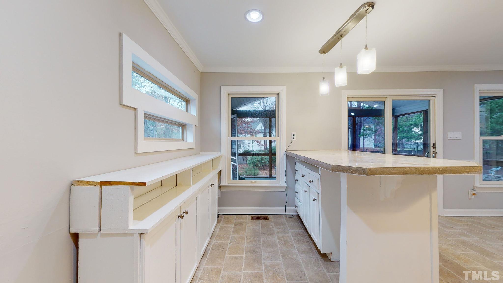1613 Jenks Carpenter Road Cary, NC 27519 - Photo 37 of 60 a bathroom with a sink a mirror and a bathtub