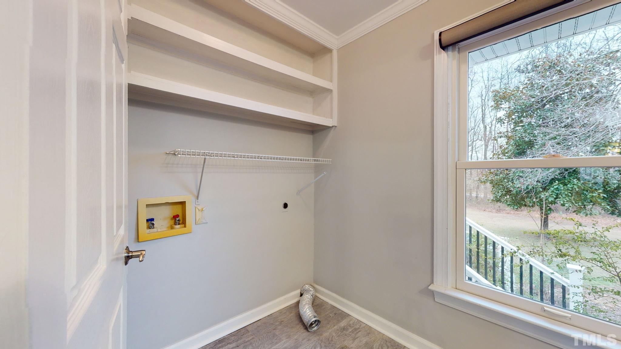 1613 Jenks Carpenter Road Cary, NC 27519 - Photo 39 of 60 a view of a hallway with a window