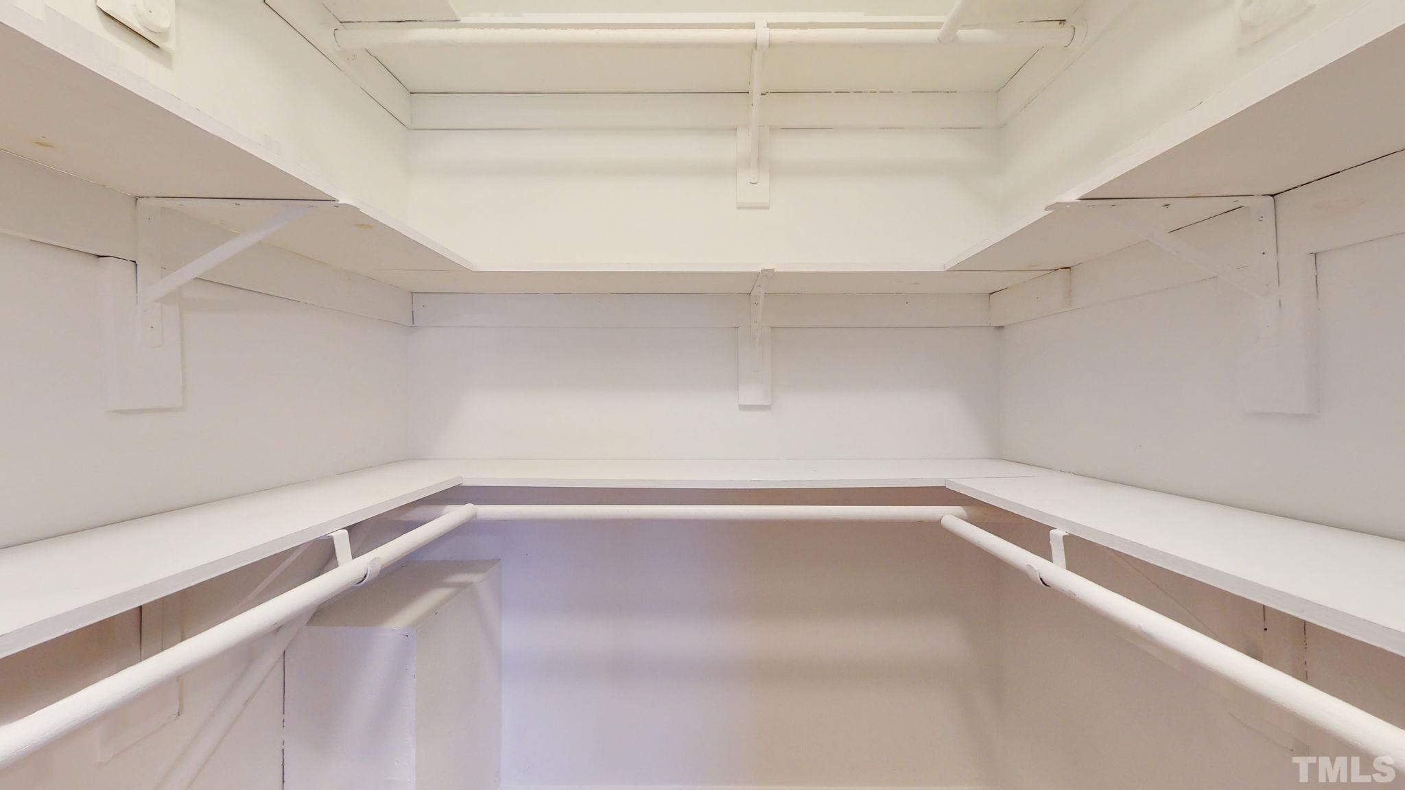 1613 Jenks Carpenter Road Cary, NC 27519 - Photo 47 of 60 a view of a room with racks on the wall