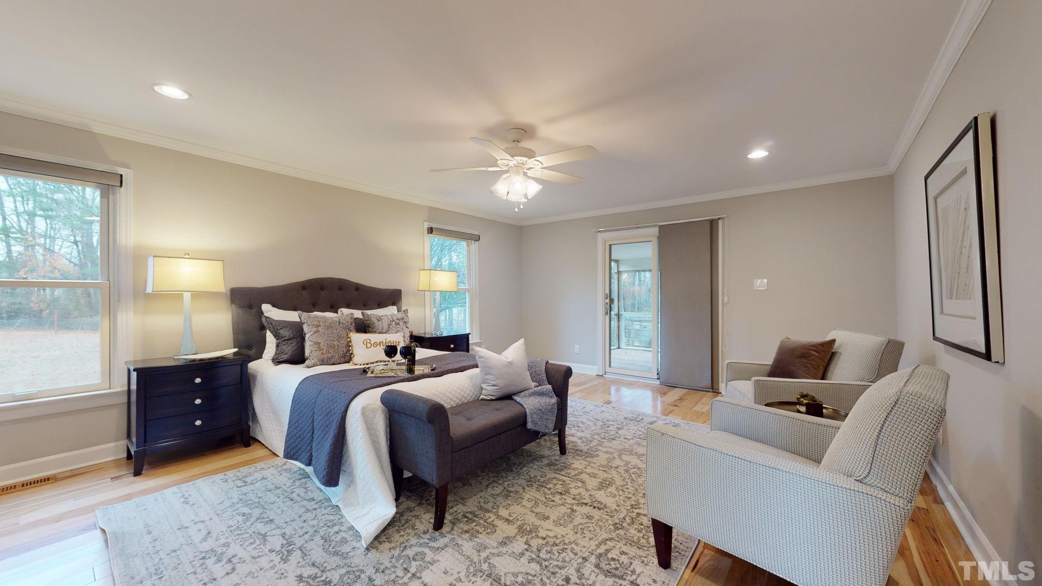 1613 Jenks Carpenter Road Cary, NC 27519 - Photo 48 of 60 a bed room with bed and a couch