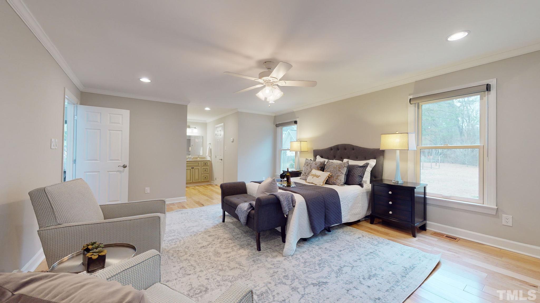 1613 Jenks Carpenter Road Cary, NC 27519 - Photo 50 of 60 a bed room with bed and a couch