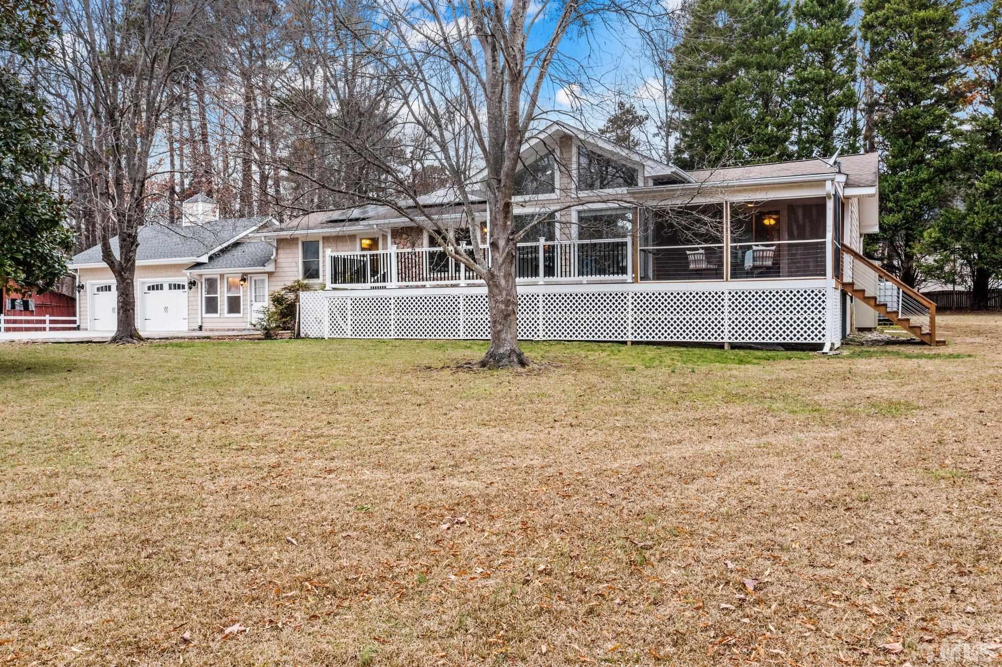 1613 Jenks Carpenter Road Cary, NC 27519 - Photo 5 of 60 a view of a house with yard and sitting area