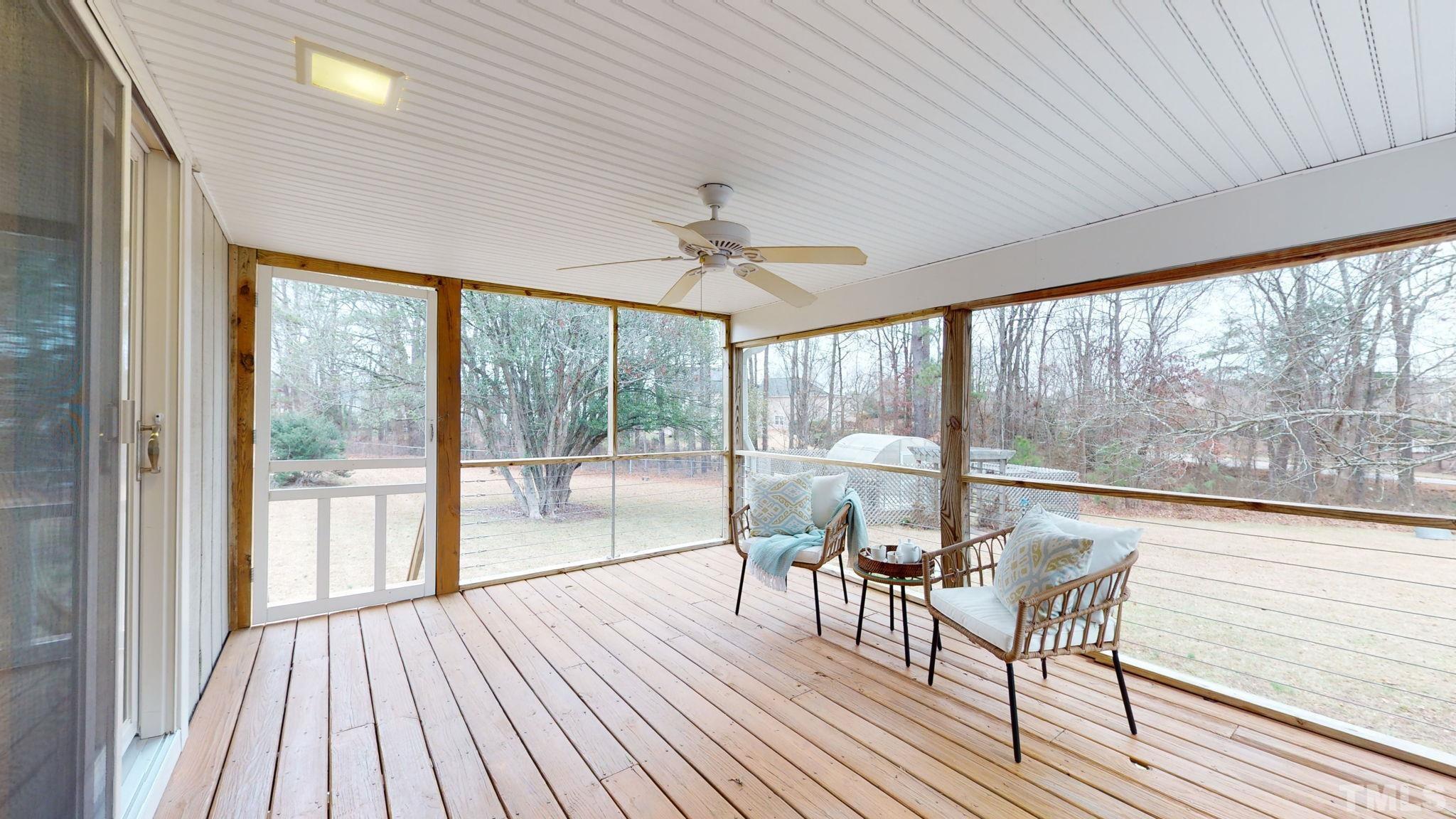 1613 Jenks Carpenter Road Cary, NC 27519 - Photo 52 of 60 a view of a dining room with furniture window and wooden floor