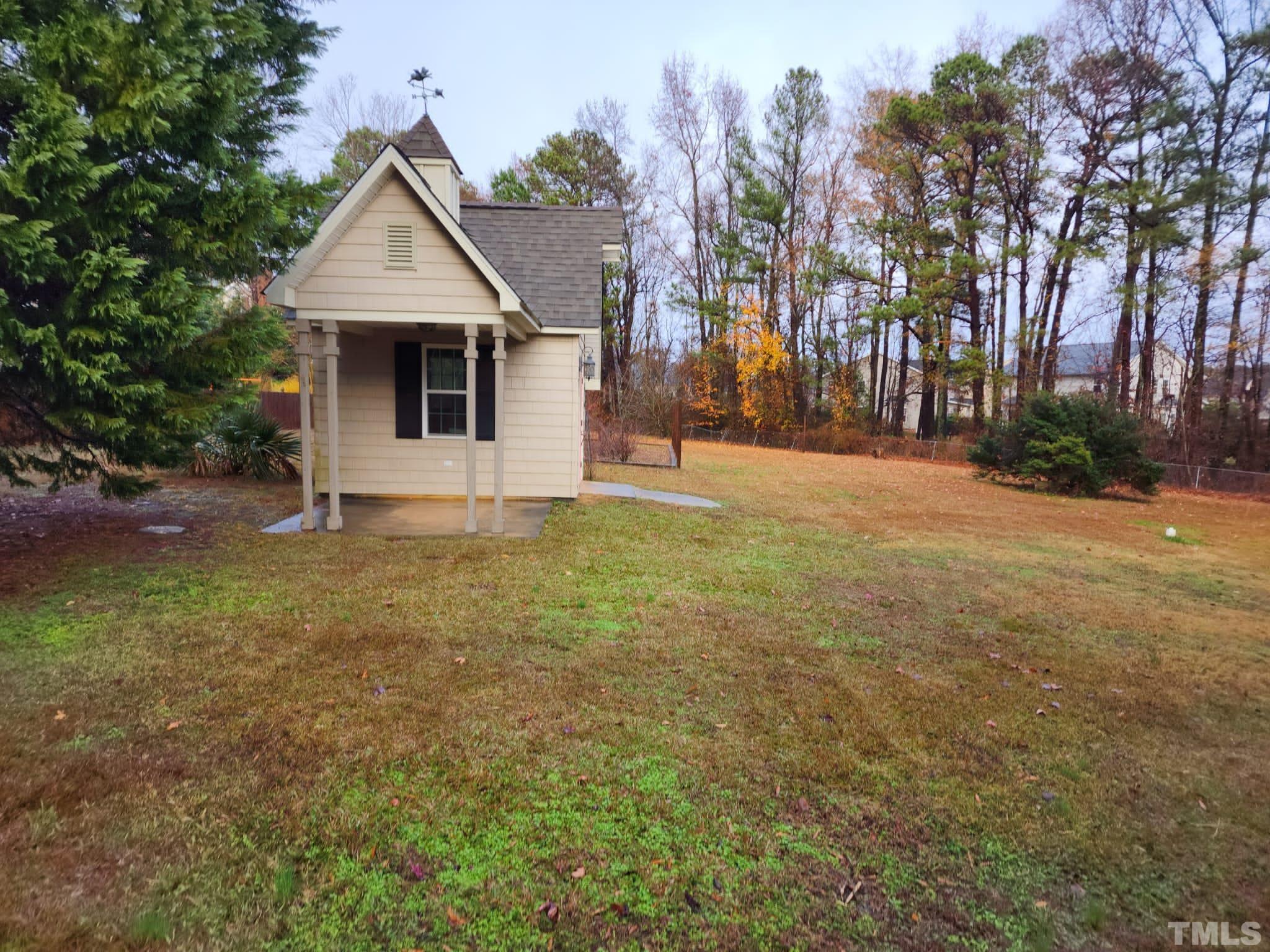 1613 Jenks Carpenter Road Cary, NC 27519 - Photo 6 of 60 a front view of a house with a yard