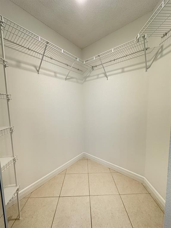 9401 Lime Bay Boulevard, Unit 115 Tamarac, FL 33321 - Photo 14 of 20 a view of a room with racks on the wall