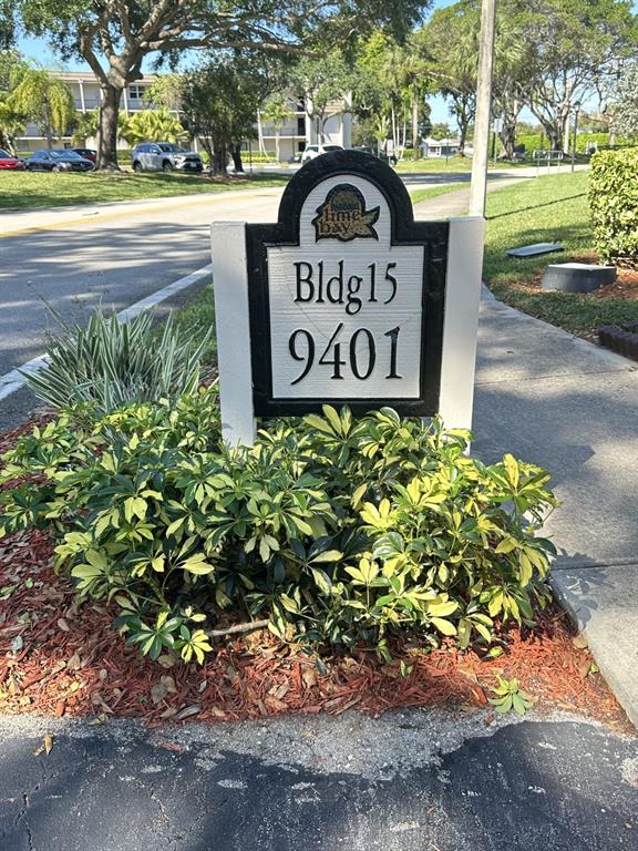 9401 Lime Bay Boulevard, Unit 115 Tamarac, FL 33321 - Photo 2 of 20 a view of a sign board with yard