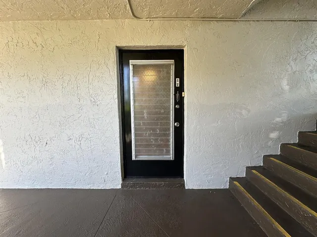 a view of an empty room with stairs