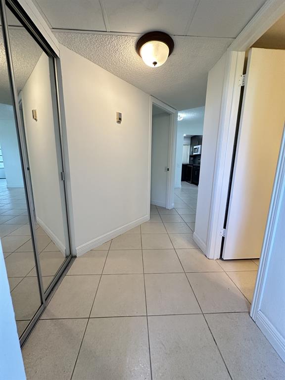 9401 Lime Bay Boulevard, Unit 115 Tamarac, FL 33321 - Photo 5 of 20 a view of a hallway to rooms