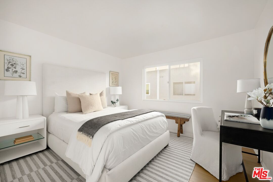 13010 Maxella Avenue, Unit 5 Marina del Rey, CA 90292 - Photo 19 of 32 a bedroom with a bed and a window