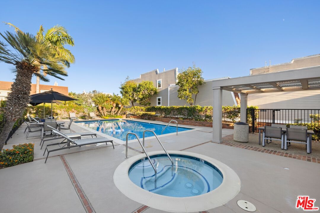 13010 Maxella Avenue, Unit 5 Marina del Rey, CA 90292 - Photo 26 of 32 a view of a swimming pool with outdoor seating