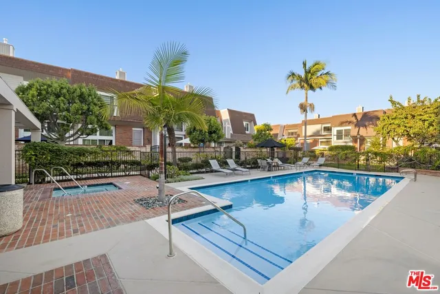 a view of a swimming pool with a lounge chairs