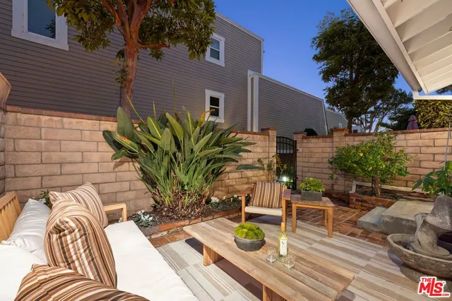 a view of a chairs and table in patio