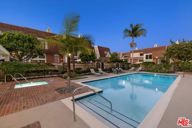 a view of a swimming pool with a patio