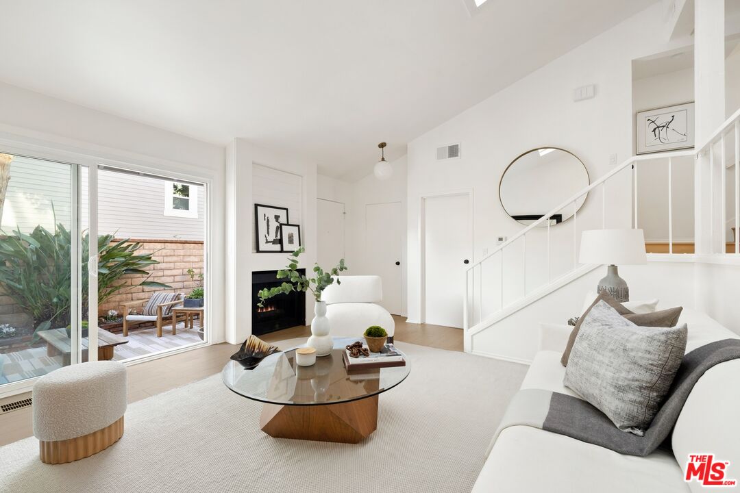 13010 Maxella Avenue, Unit 5 Marina del Rey, CA 90292 - Photo 5 of 32 a living room with furniture and a large window