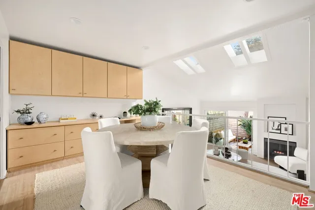 a kitchen with granite countertop a sink stove and cabinets