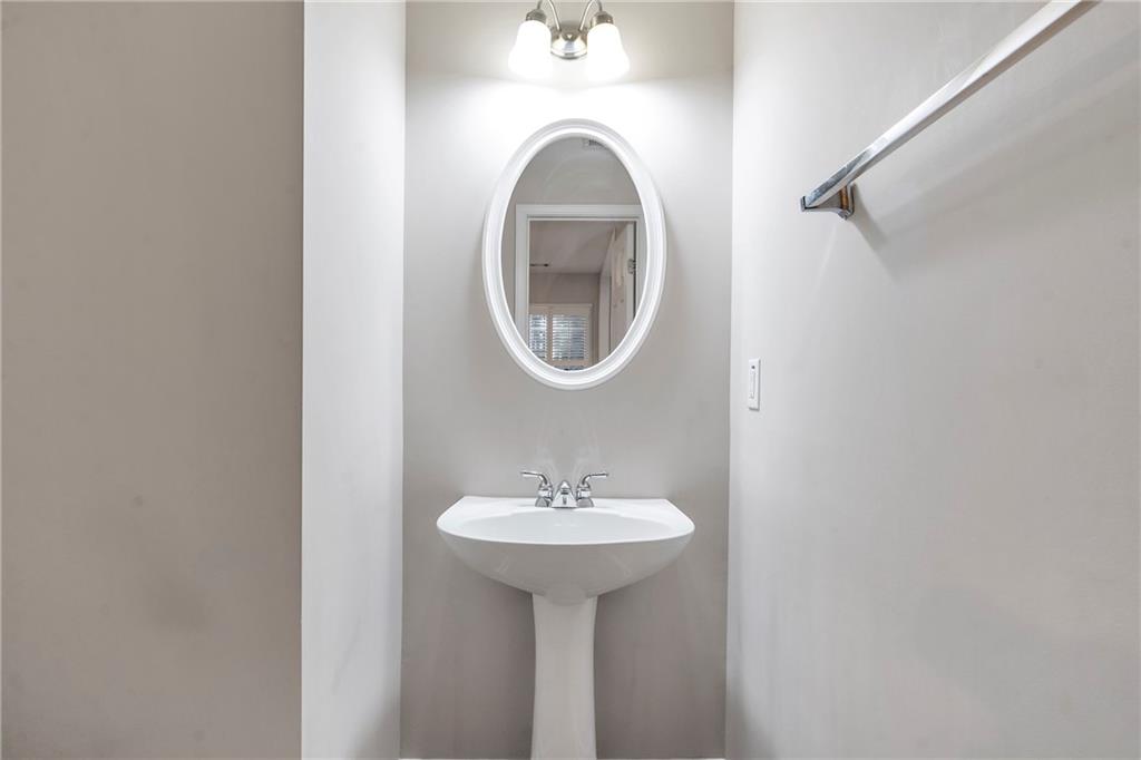 1653 Fair Oak Way Mableton, GA 30126 - Photo 11 of 30 a bathroom with a sink and a mirror
