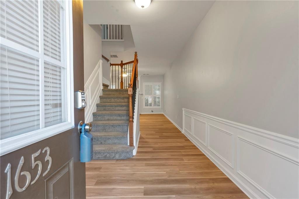 1653 Fair Oak Way Mableton, GA 30126 - Photo 2 of 30 a view of entryway and hall with wooden floor