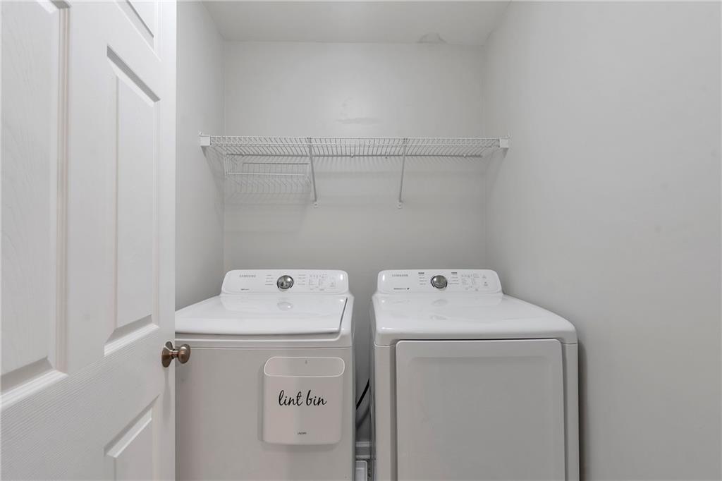 1653 Fair Oak Way Mableton, GA 30126 - Photo 25 of 30 a utility room with dryer and washer